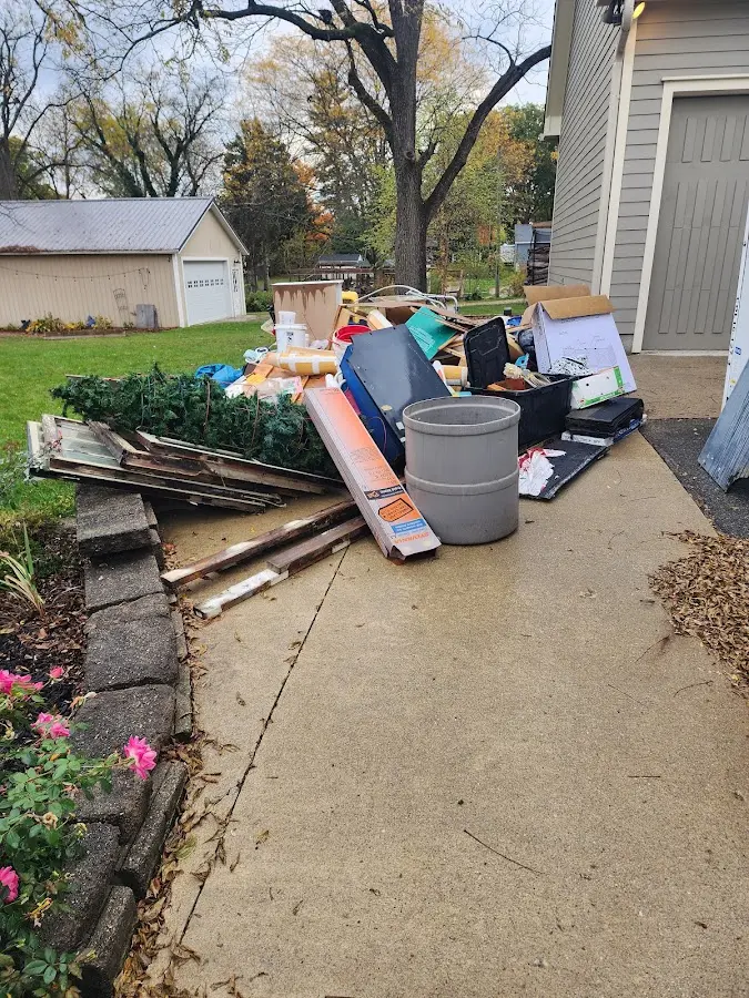 Dumpster being loaded with debris for 3 Yard Dumpster Rental in Lake Dallas